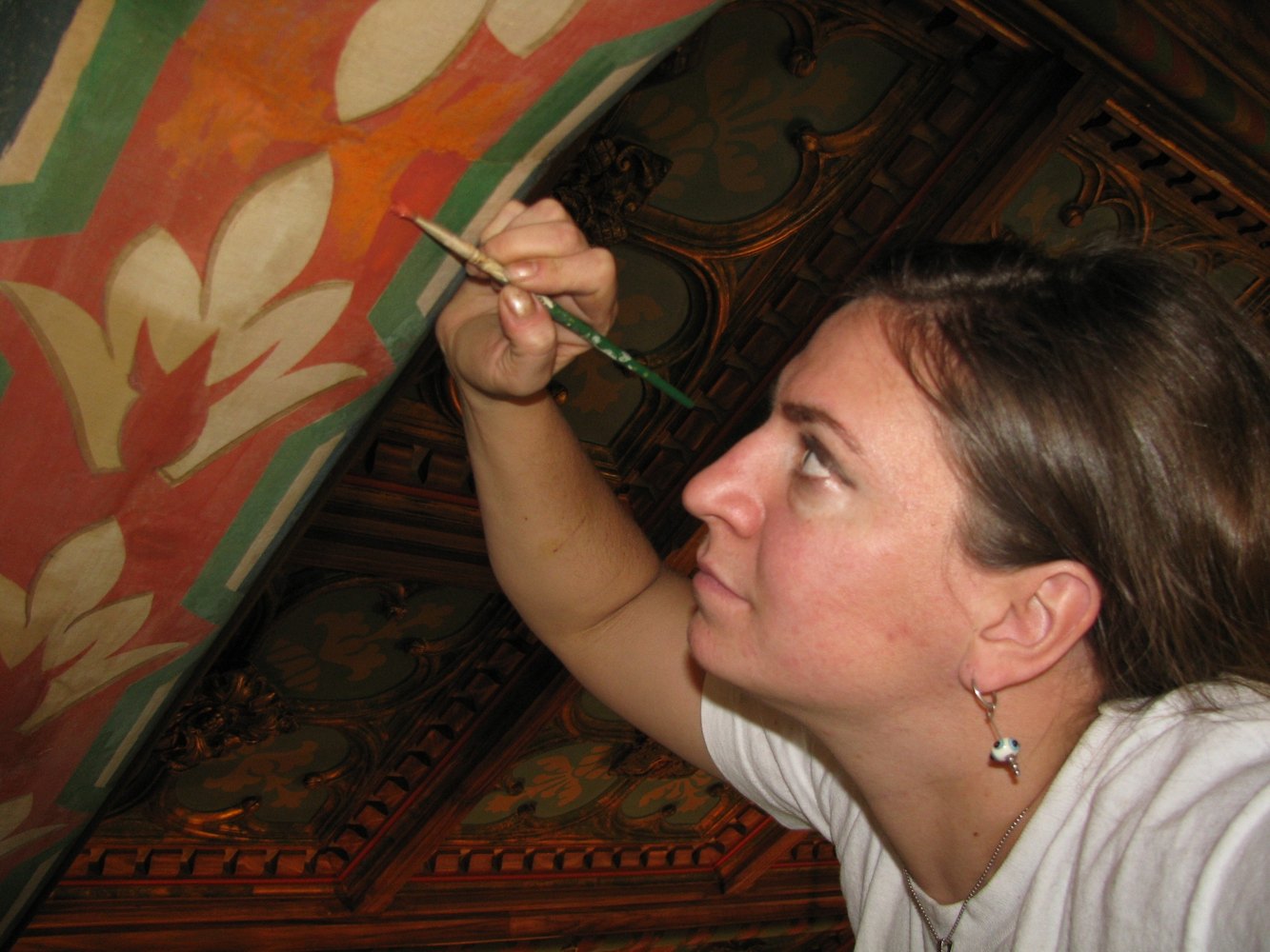 Deb working on restoration and decorative painting